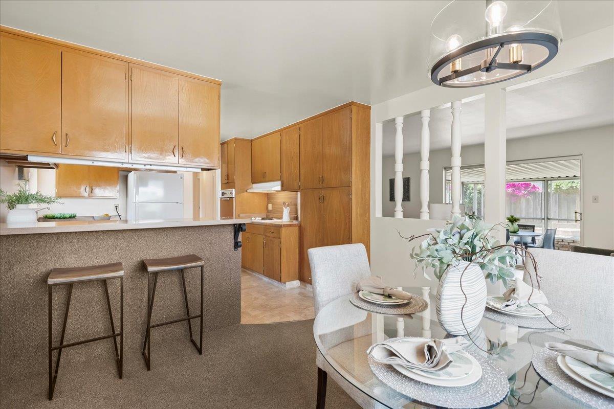 5371 Clovercrest Drive San Jose, CA 95118 - Photo 11 of 29 a kitchen with a table and chairs