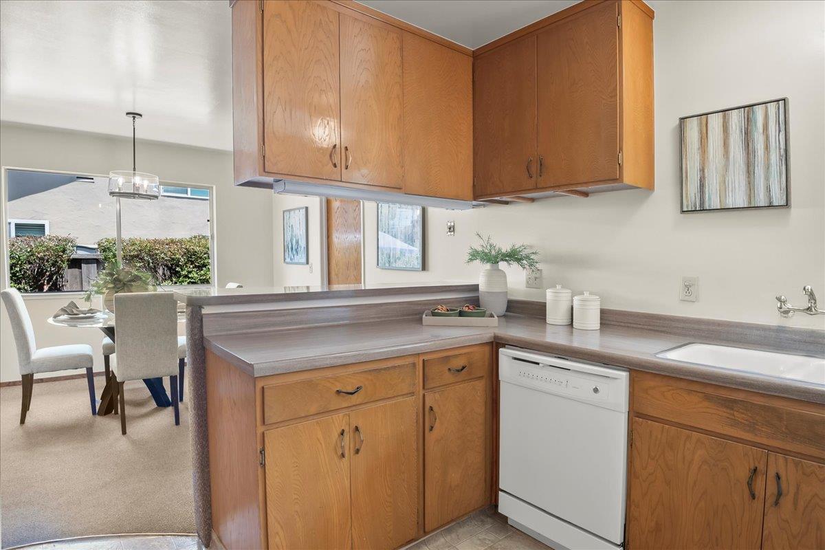 5371 Clovercrest Drive San Jose, CA 95118 - Photo 13 of 29 a kitchen with a sink cabinets and a window