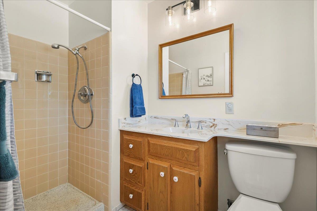 5371 Clovercrest Drive San Jose, CA 95118 - Photo 17 of 29 a bathroom with a granite countertop sink toilet and shower