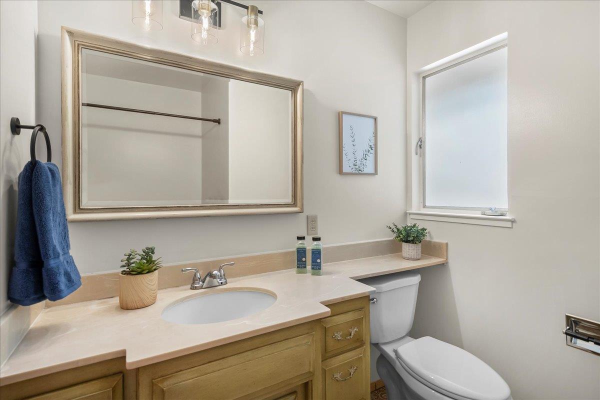 5371 Clovercrest Drive San Jose, CA 95118 - Photo 22 of 29 a bathroom with a sink a toilet and mirror