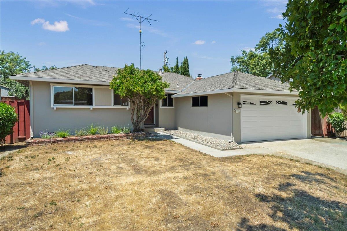 5371 Clovercrest Drive San Jose, CA 95118 - Photo 25 of 29 a front view of a house with a yard and garage