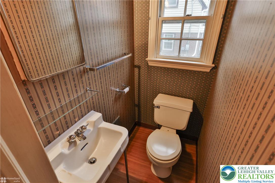 1104 Raymond Avenue Bethlehem, PA 18018 - Photo 20 of 67 a bathroom with a toilet sink and mirror
