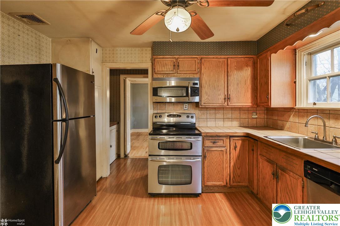 1104 Raymond Avenue Bethlehem, PA 18018 - Photo 23 of 67 a kitchen with a refrigerator stove and sink
