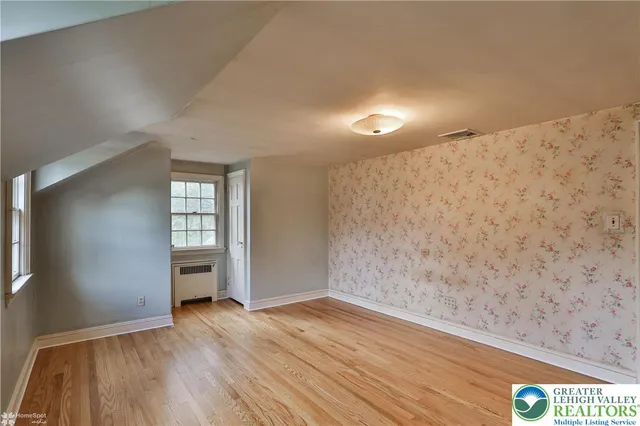 a bathroom with a sink mirror vanity and toilet