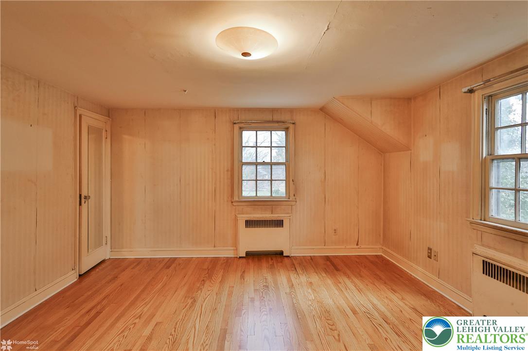 1104 Raymond Avenue Bethlehem, PA 18018 - Photo 34 of 67 an empty room with wooden floor and windows