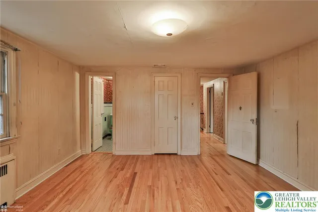 a view of gallery with wooden floor