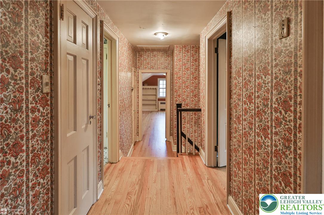 1104 Raymond Avenue Bethlehem, PA 18018 - Photo 53 of 67 a view of a hallway with wooden floor and staircase