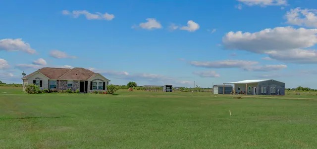 a view of a house with a big yard