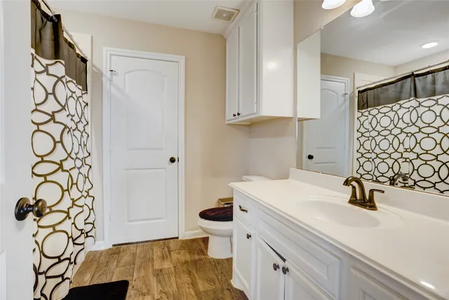 a view of bathroom with a sink and mirror