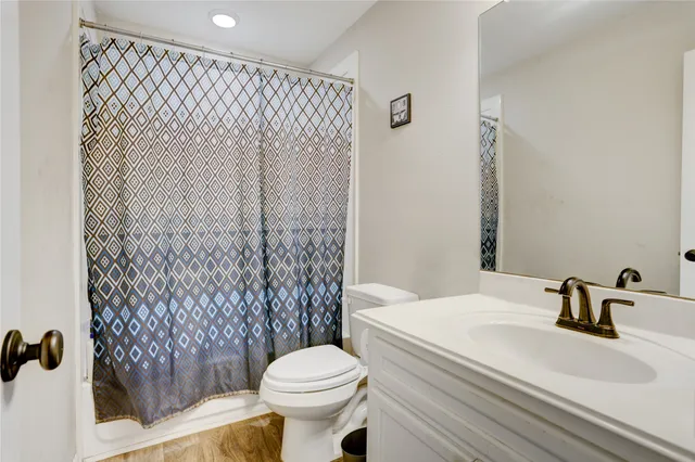 a bathroom with a sink and toilet
