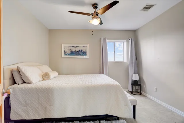 a bedroom with a bed and dresser