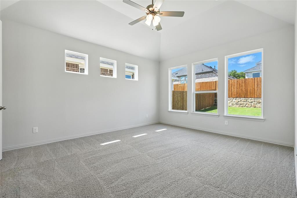 1434 Odette Drive Arlington, TX 76013 - Photo 16 of 38 Carpeted empty room featuring ceiling fan and lofted ceiling