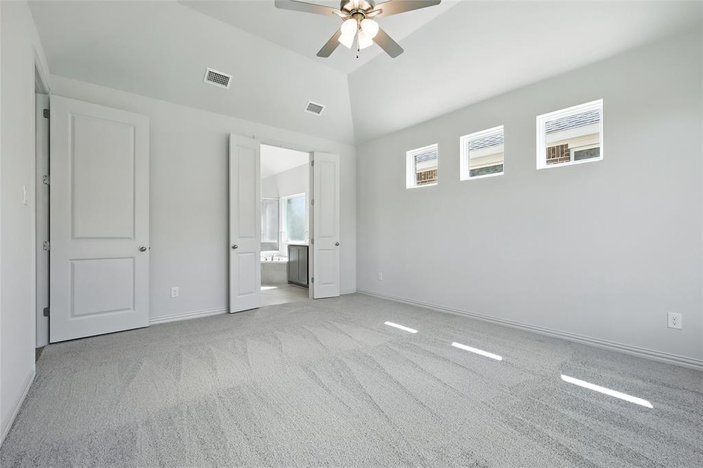 1434 Odette Drive Arlington, TX 76013 - Photo 19 of 38 Unfurnished bedroom with carpet, high vaulted ceiling, ensuite bath, and ceiling fan