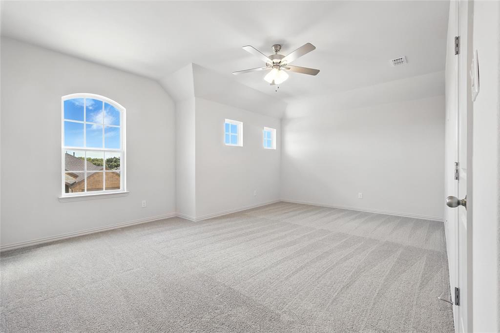 1434 Odette Drive Arlington, TX 76013 - Photo 27 of 38 Unfurnished room featuring healthy amount of natural light, light colored carpet, and a ceiling fan