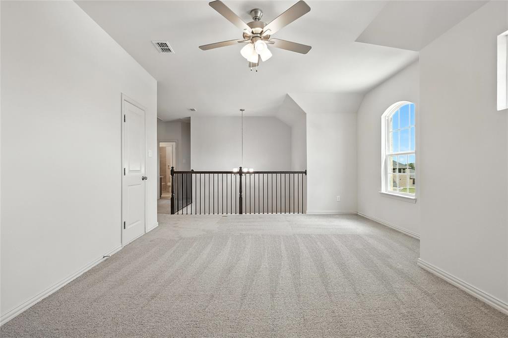 1434 Odette Drive Arlington, TX 76013 - Photo 29 of 38 Spare room with a ceiling fan and light carpet