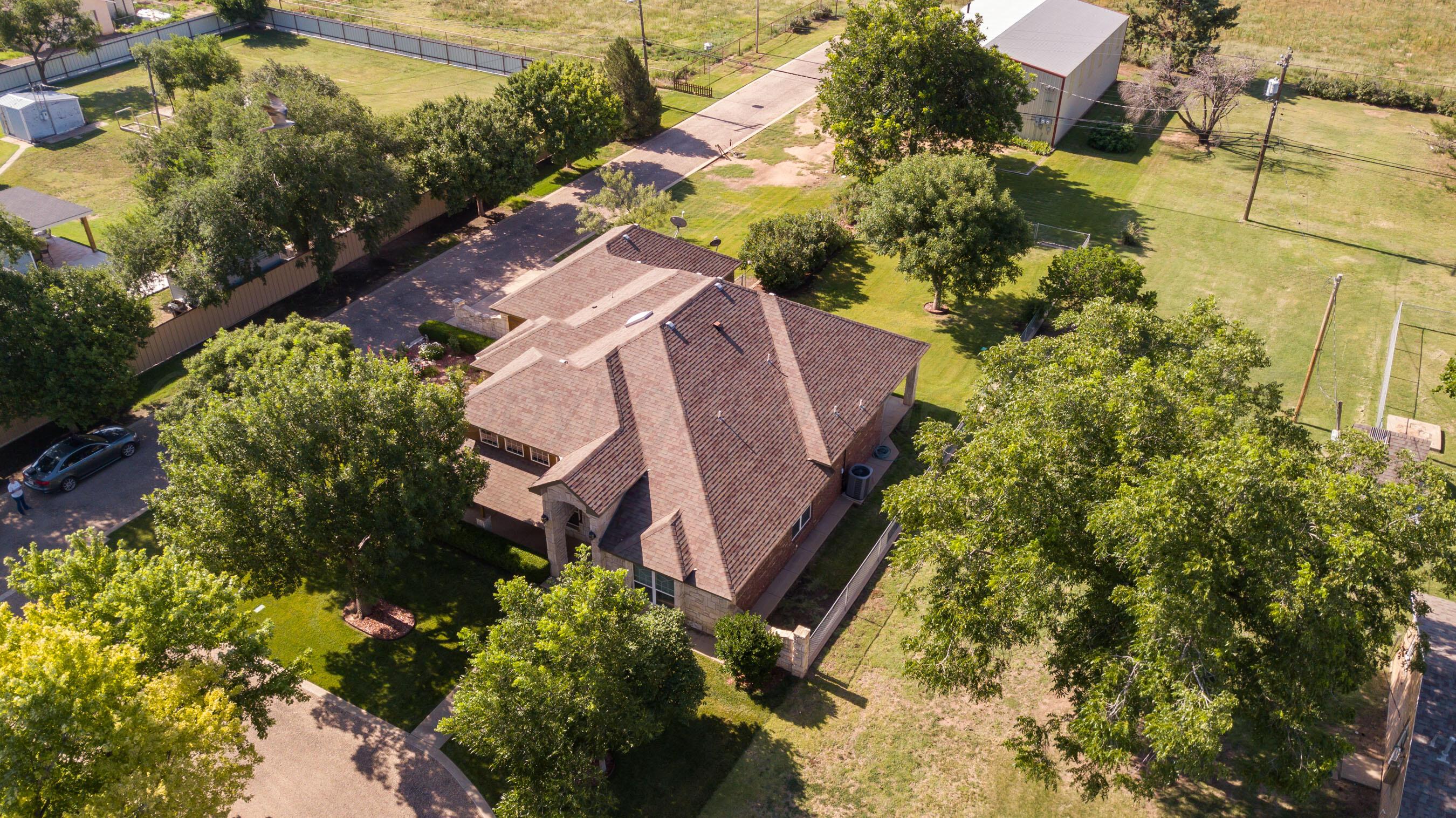 4823 Arden Road Amarillo, TX 79110 - Photo 11 of 53 a view of a yard with plants