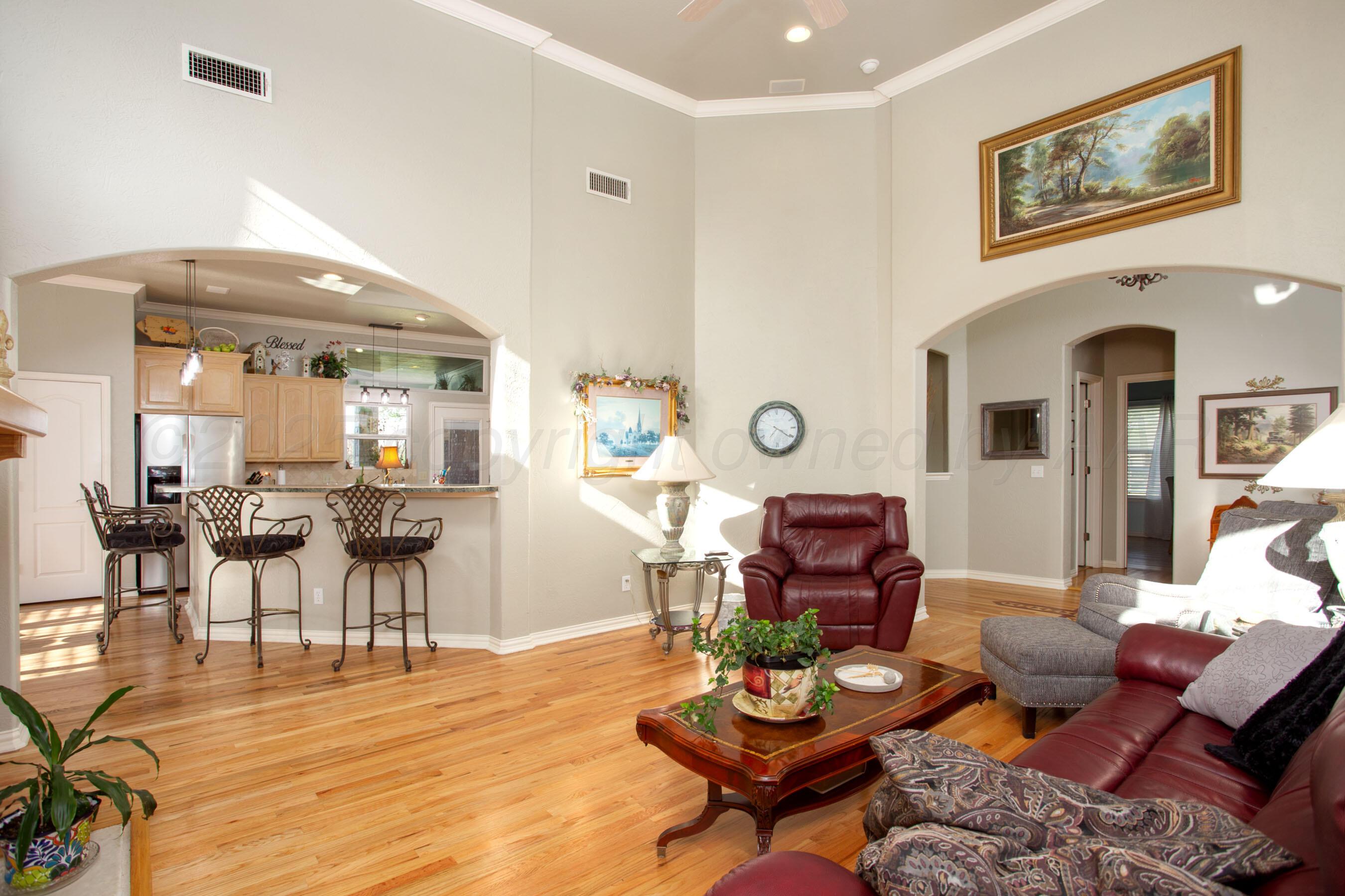 4823 Arden Road Amarillo, TX 79110 - Photo 16 of 53 a living room with furniture and wooden floor