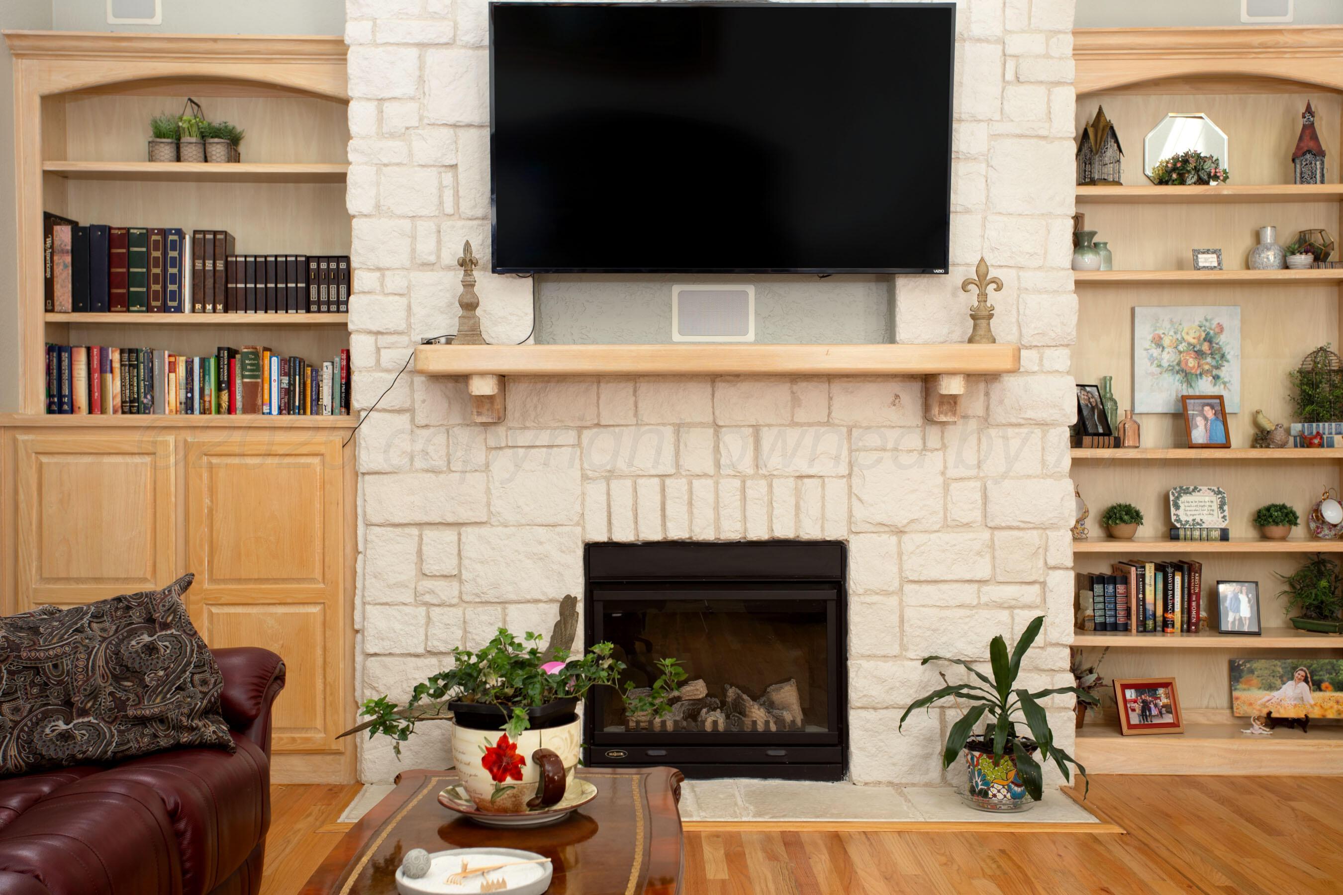 4823 Arden Road Amarillo, TX 79110 - Photo 18 of 53 a living room with furniture and a fireplace