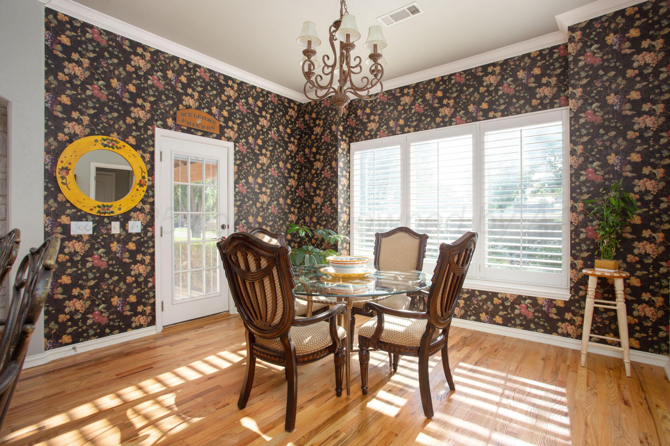 4823 Arden Road Amarillo, TX 79110 - Photo 20 of 53 a view of a dining room with furniture and chandelier