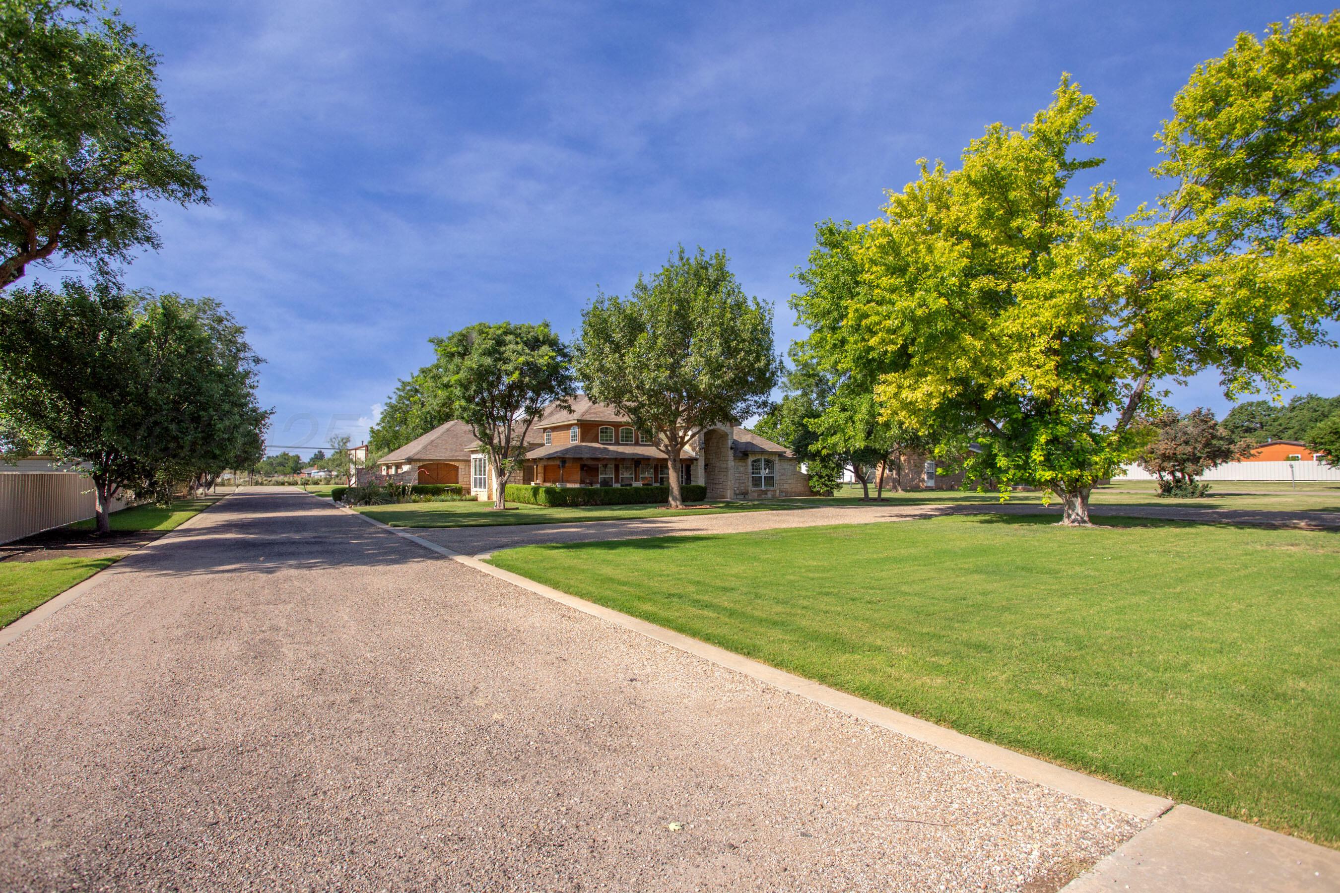 4823 Arden Road Amarillo, TX 79110 - Photo 2 of 53 a view of a park with large trees