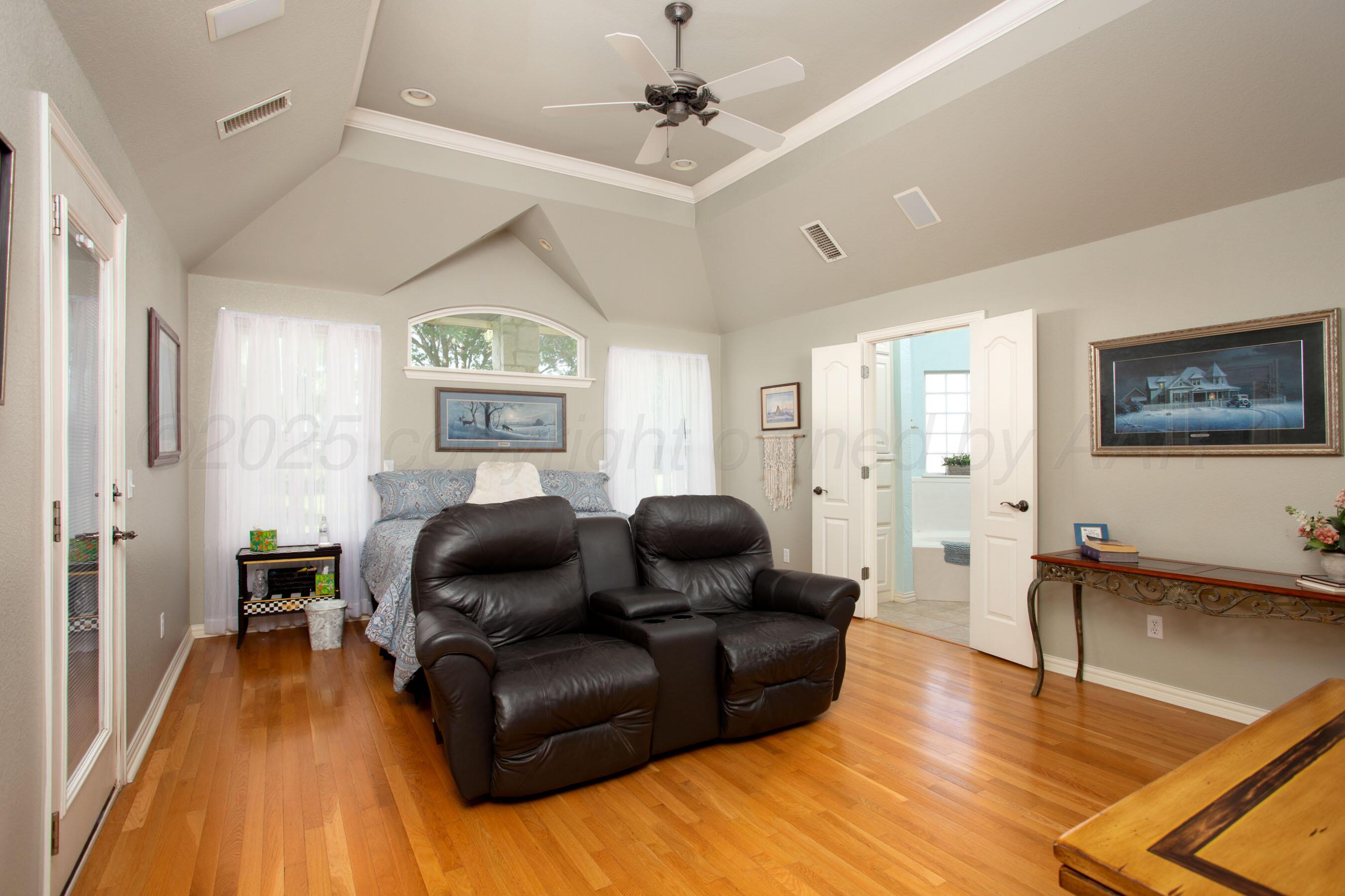 4823 Arden Road Amarillo, TX 79110 - Photo 25 of 53 a living room with furniture and a wooden floor