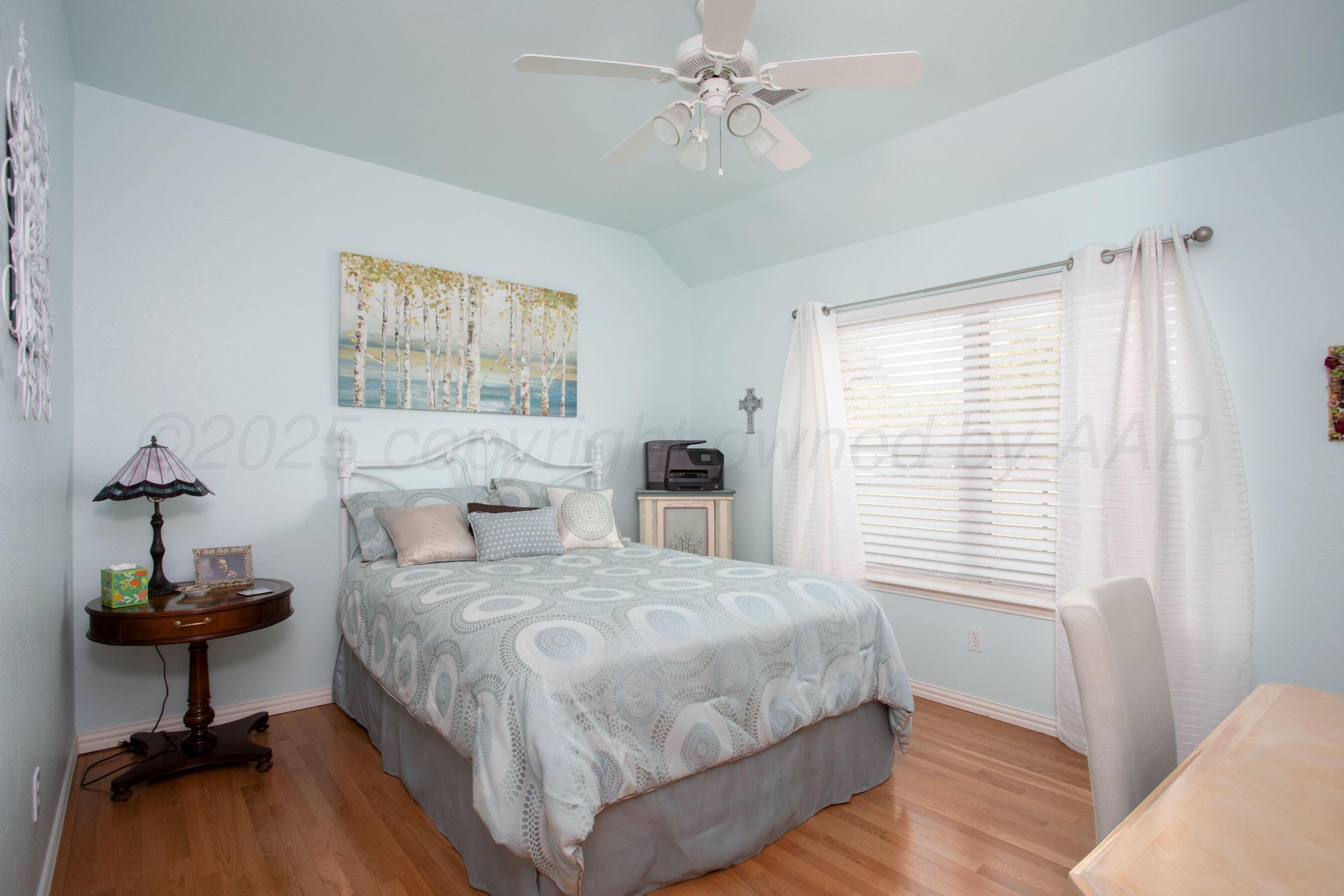 4823 Arden Road Amarillo, TX 79110 - Photo 32 of 53 a bedroom with a bed and a window