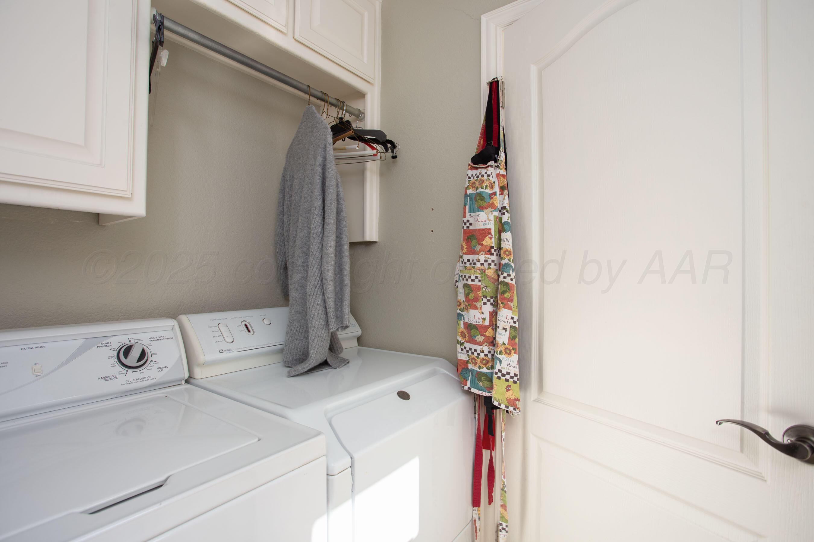 4823 Arden Road Amarillo, TX 79110 - Photo 37 of 53 a utility room with dryer and washer
