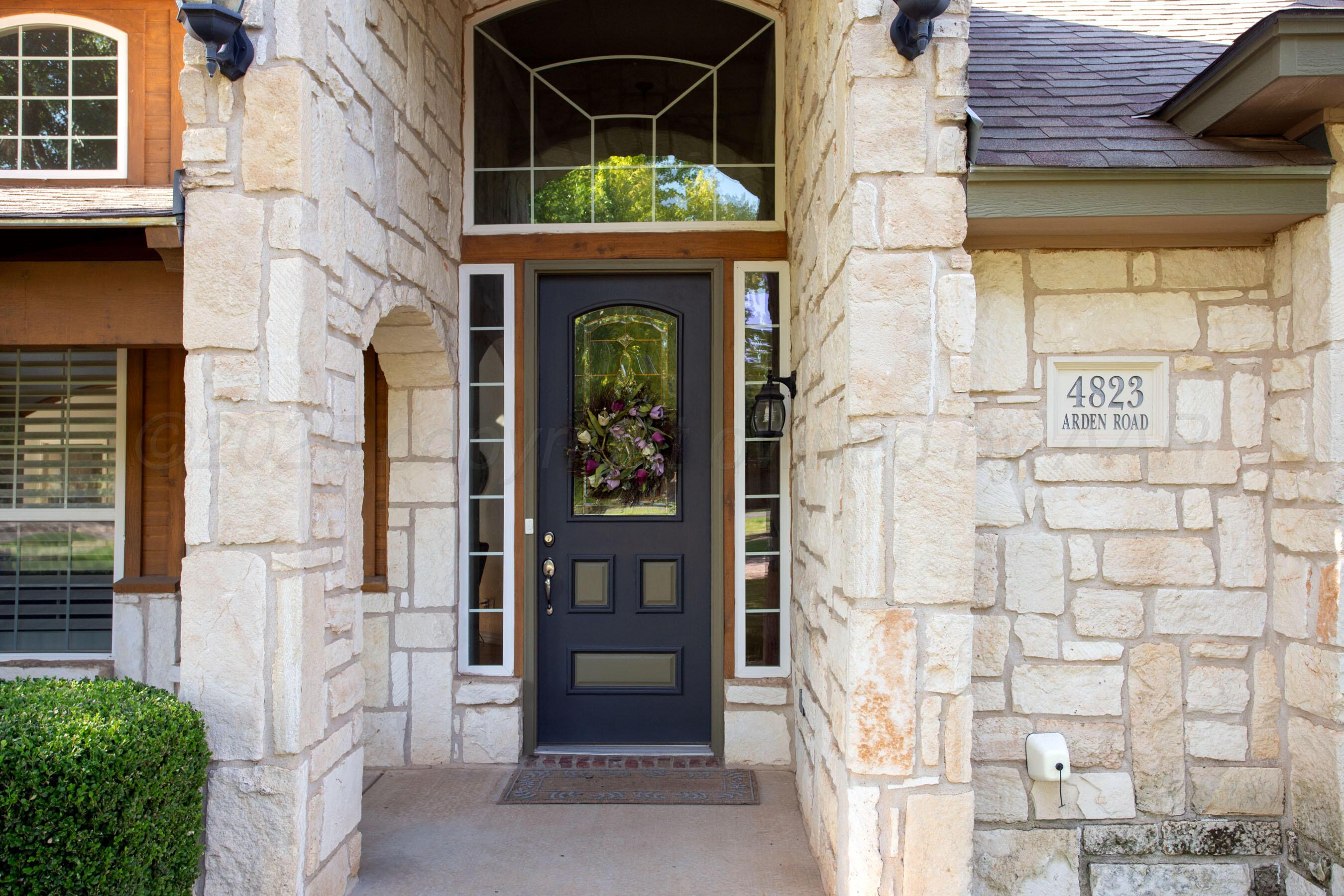 4823 Arden Road Amarillo, TX 79110 - Photo 4 of 53 a front view of a house with a glass door