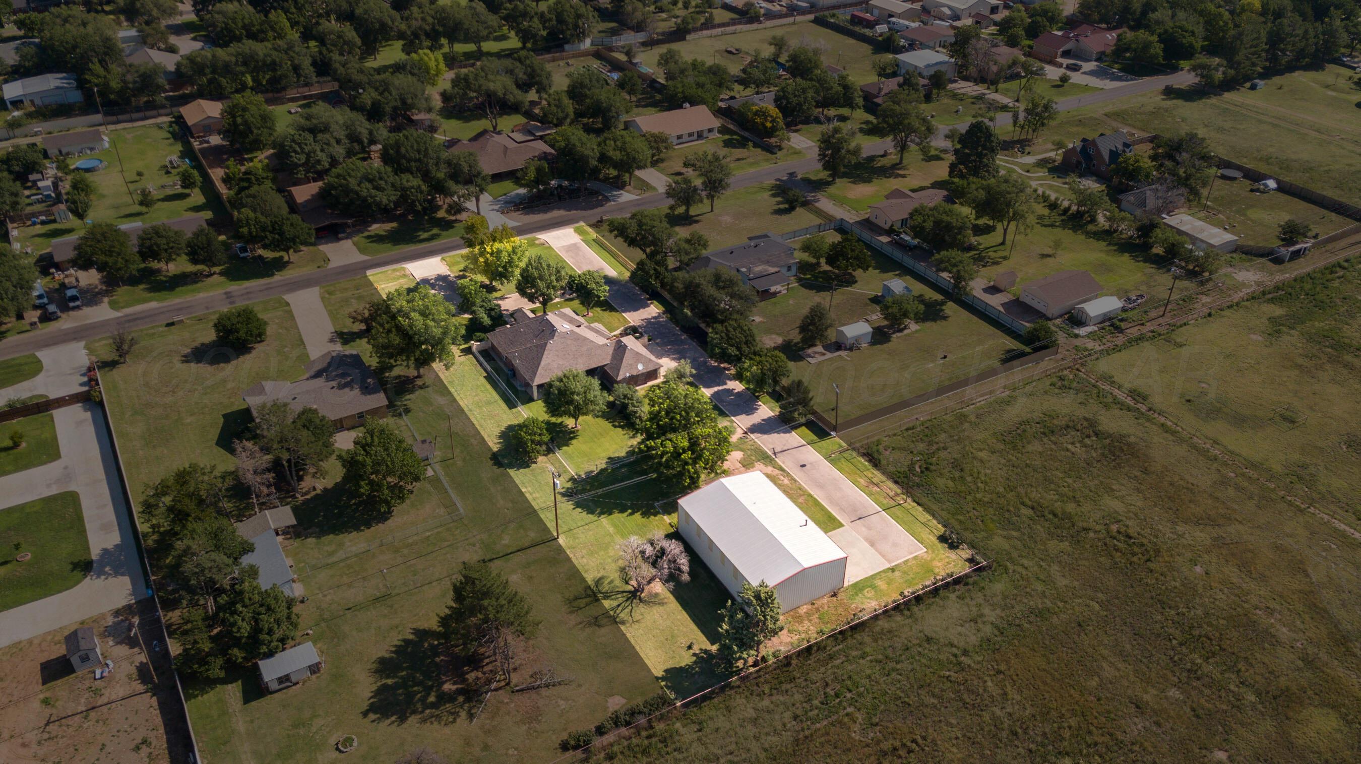 4823 Arden Road Amarillo, TX 79110 - Photo 51 of 53 an aerial view of a house with a yard