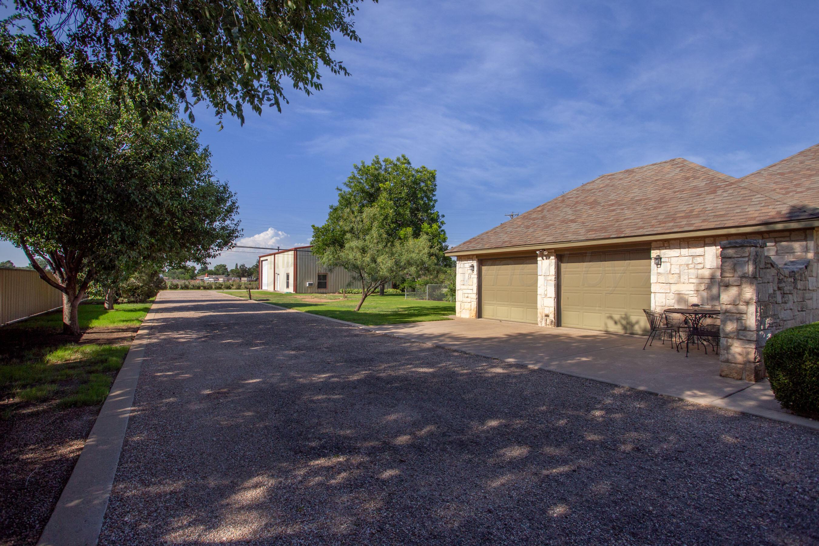 4823 Arden Road Amarillo, TX 79110 - Photo 8 of 53 a view of a house with backyard and a tree