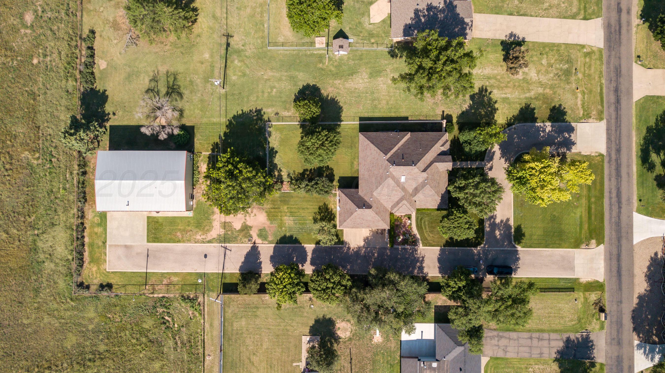 4823 Arden Road Amarillo, TX 79110 - Photo 10 of 53 aerial view of a house with a yard and large trees
