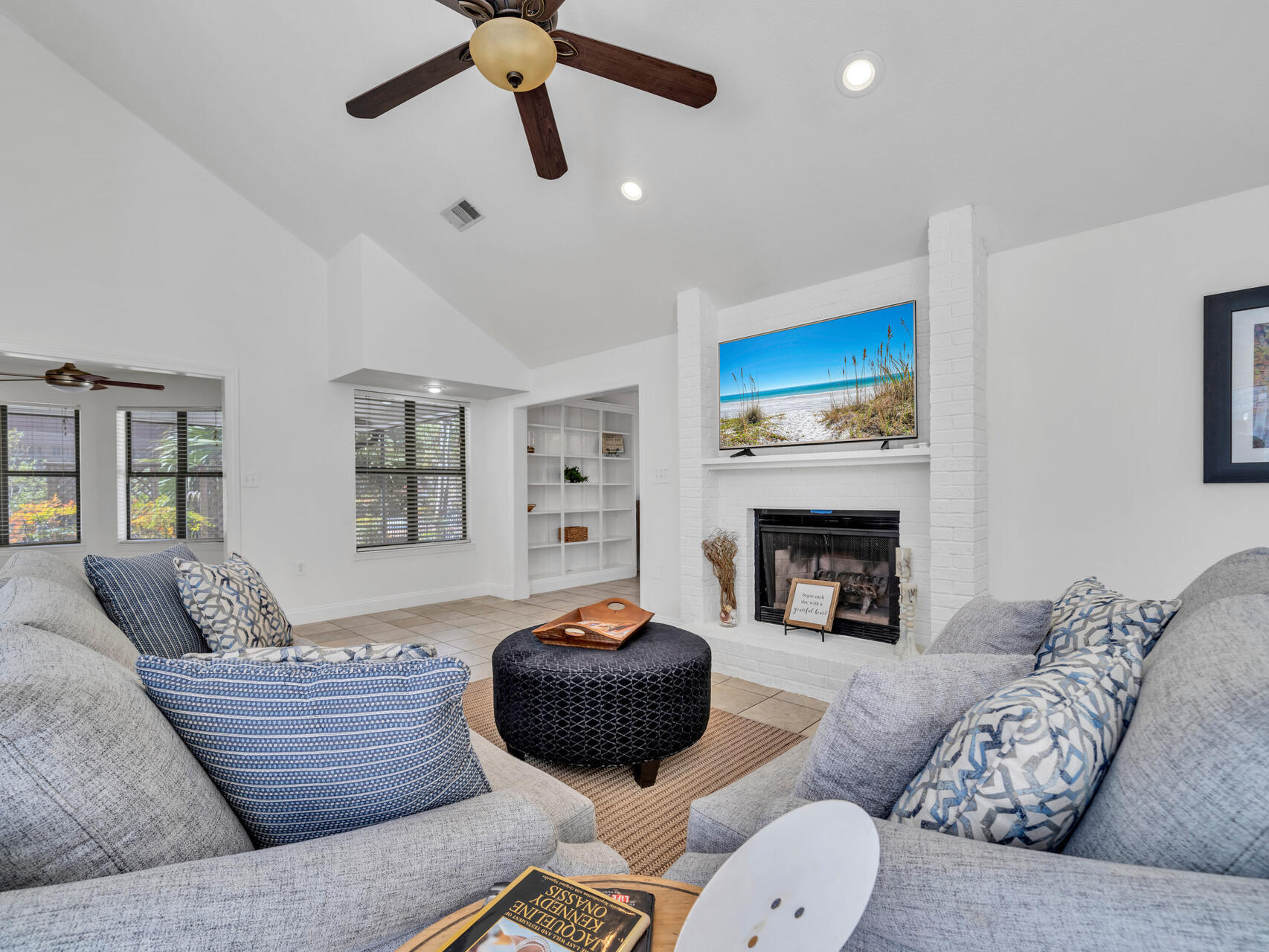 1182 Muirfield Way Niceville, FL 32578 - Photo 15 of 45 a living room with furniture a fireplace and a flat screen tv