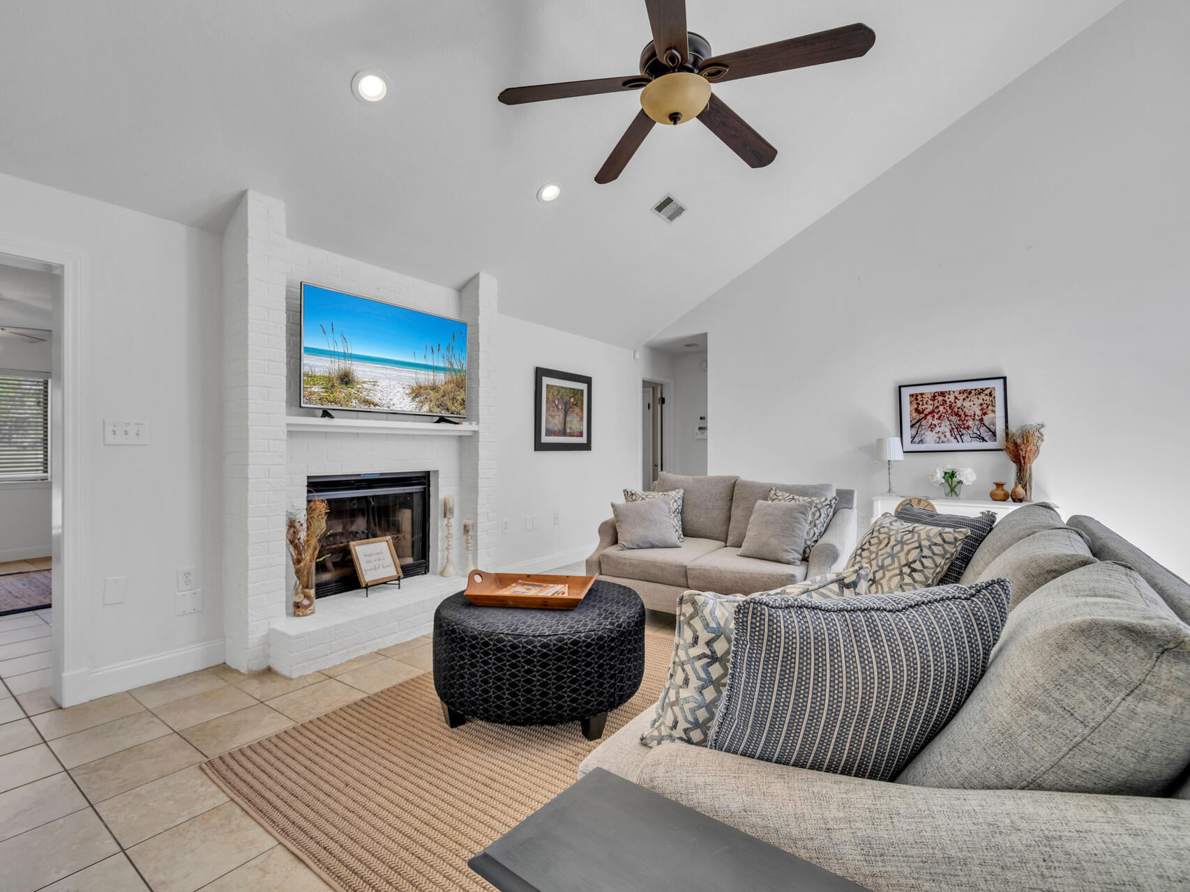 1182 Muirfield Way Niceville, FL 32578 - Photo 16 of 45 a living room with furniture a fireplace and a flat screen tv