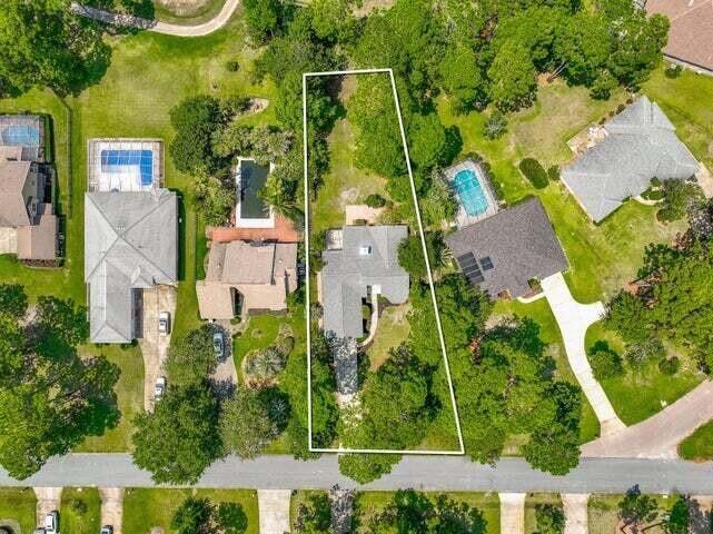1182 Muirfield Way Niceville, FL 32578 - Photo 2 of 45 an aerial view of a residential houses with yard and swimming pool