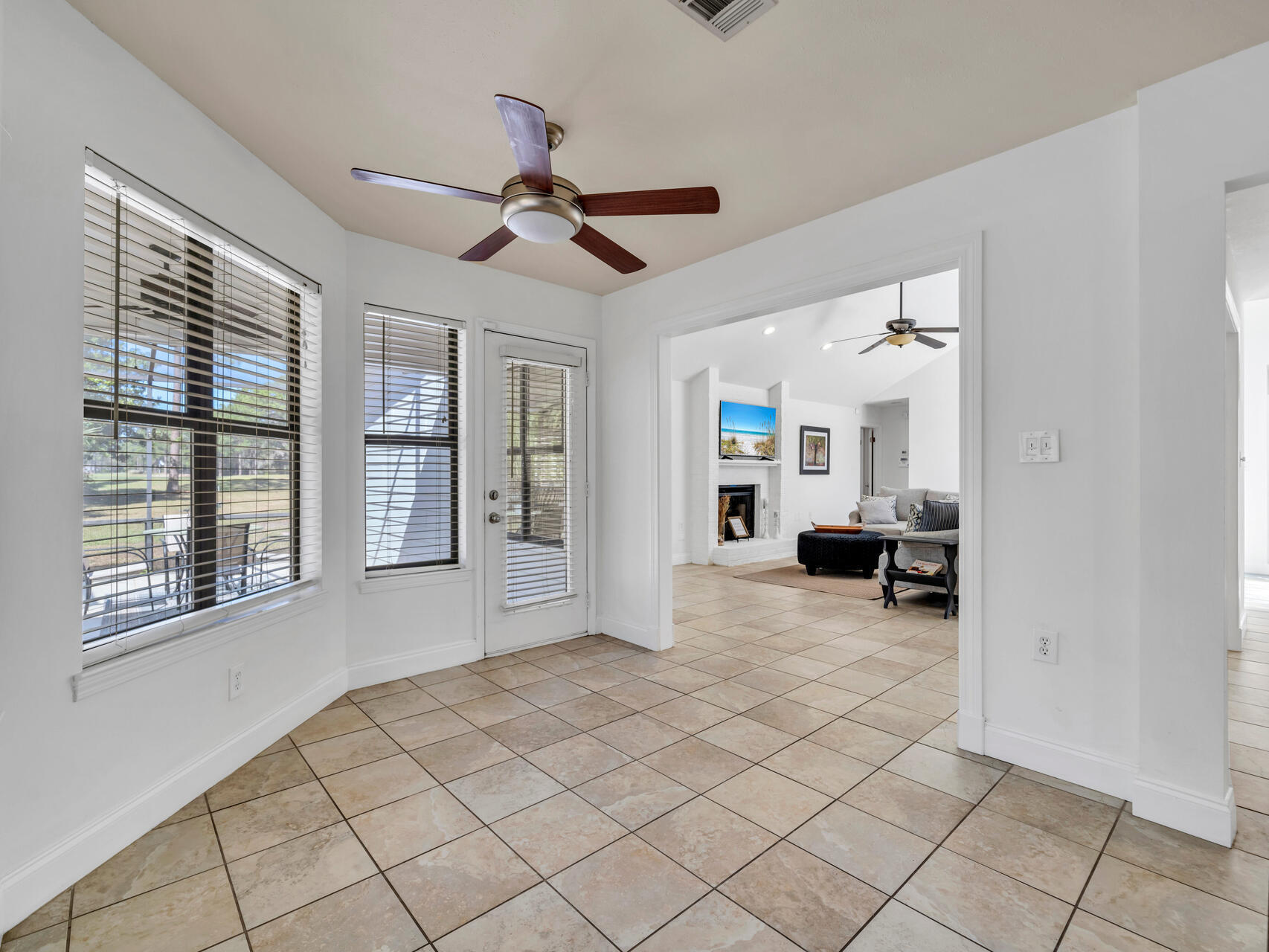 1182 Muirfield Way Niceville, FL 32578 - Photo 22 of 45 a view of a livingroom with a ceiling fan and window