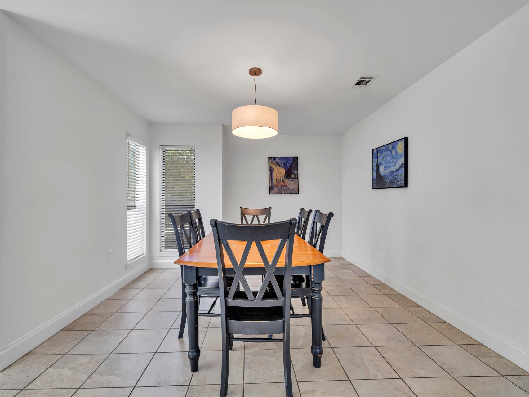 1182 Muirfield Way Niceville, FL 32578 - Photo 24 of 45 a dining room with furniture and a chandelier