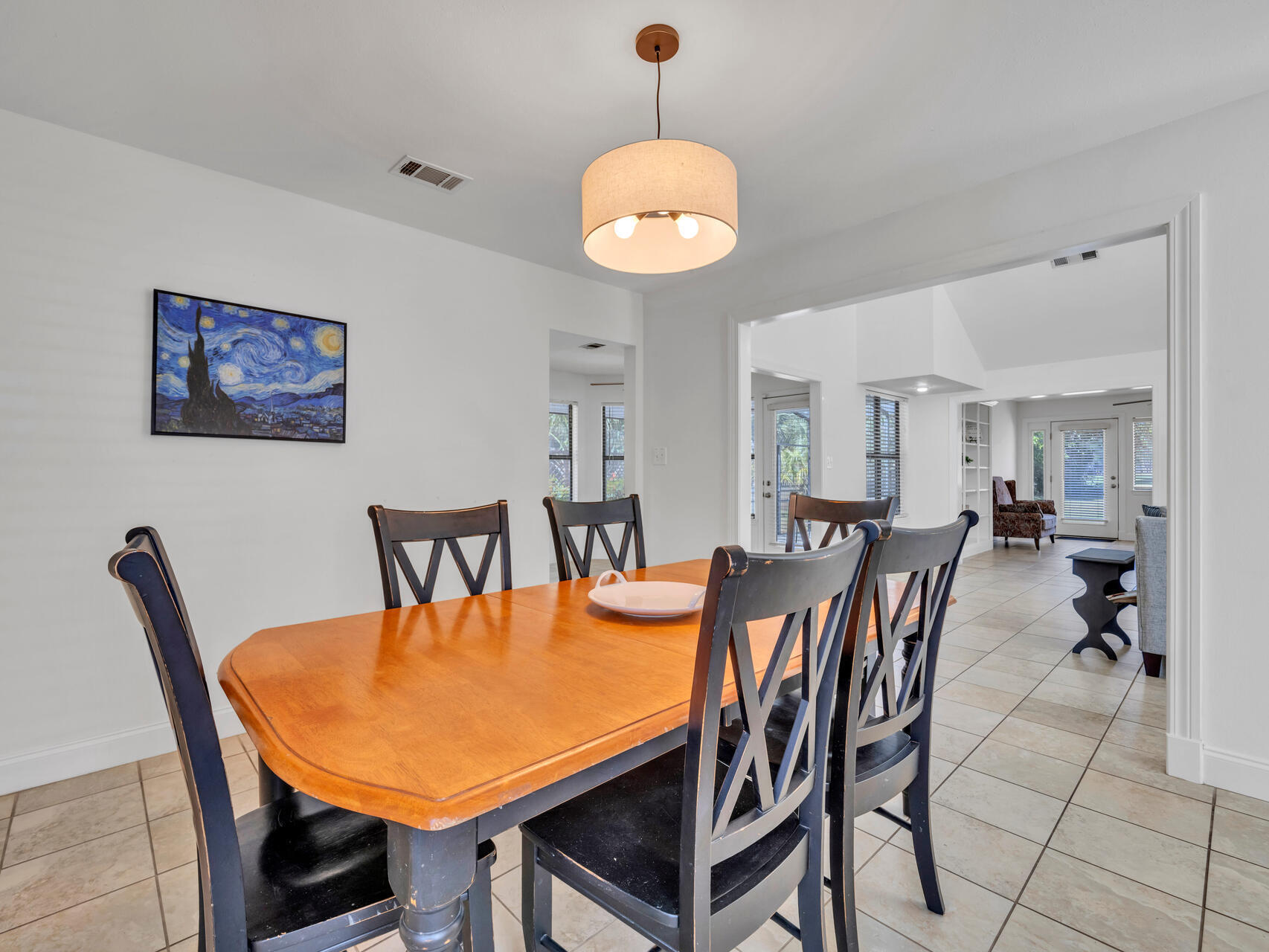 1182 Muirfield Way Niceville, FL 32578 - Photo 26 of 45 a view of a dining room with furniture and chandelier