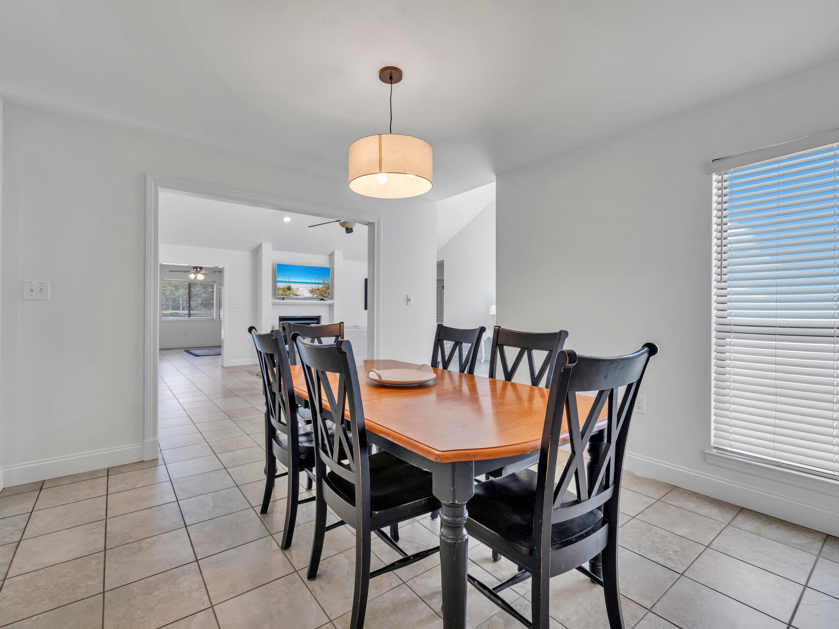 1182 Muirfield Way Niceville, FL 32578 - Photo 27 of 45 a view of a dining room with furniture and chandelier