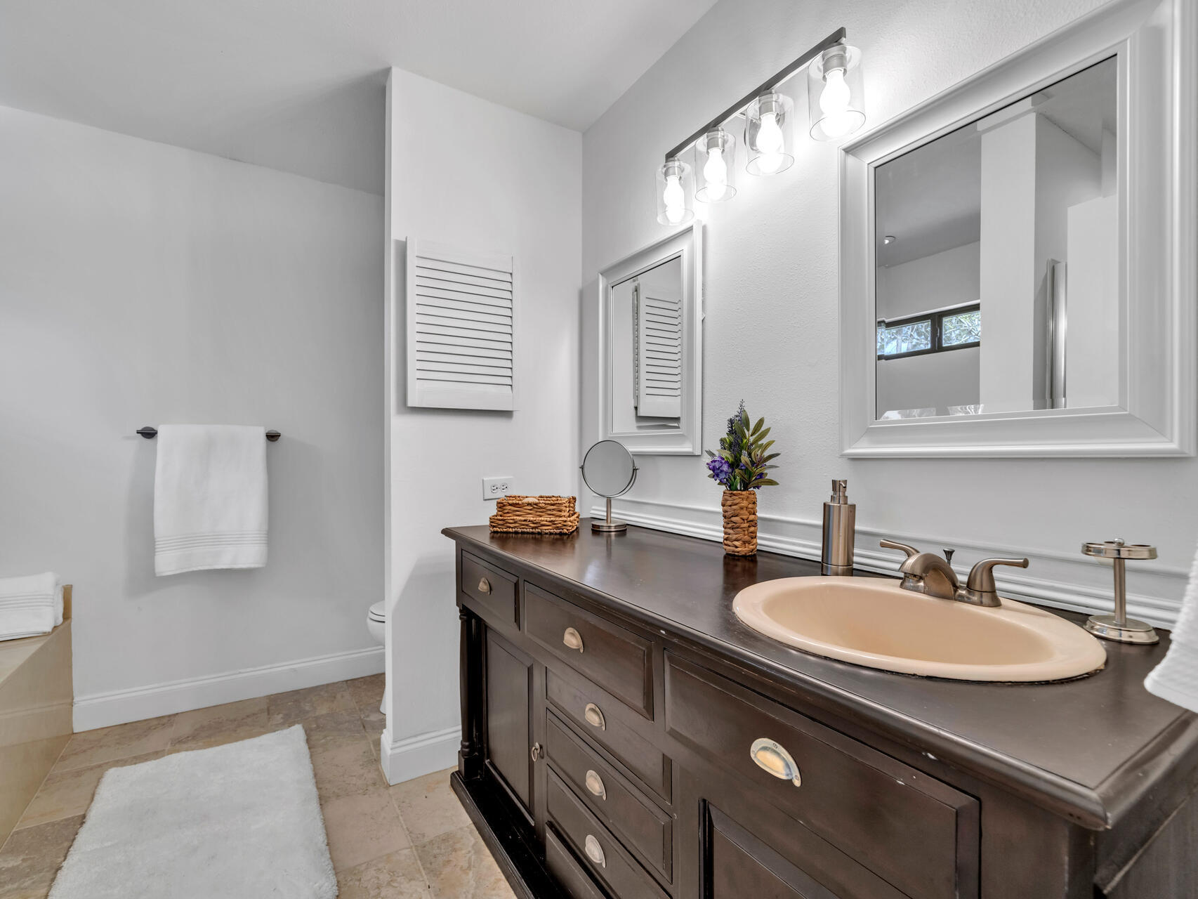 1182 Muirfield Way Niceville, FL 32578 - Photo 32 of 45 a bathroom with a granite countertop sink and a mirror