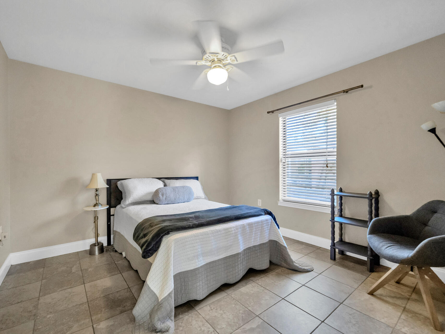 1182 Muirfield Way Niceville, FL 32578 - Photo 35 of 45 a bed room with a bed and a chair