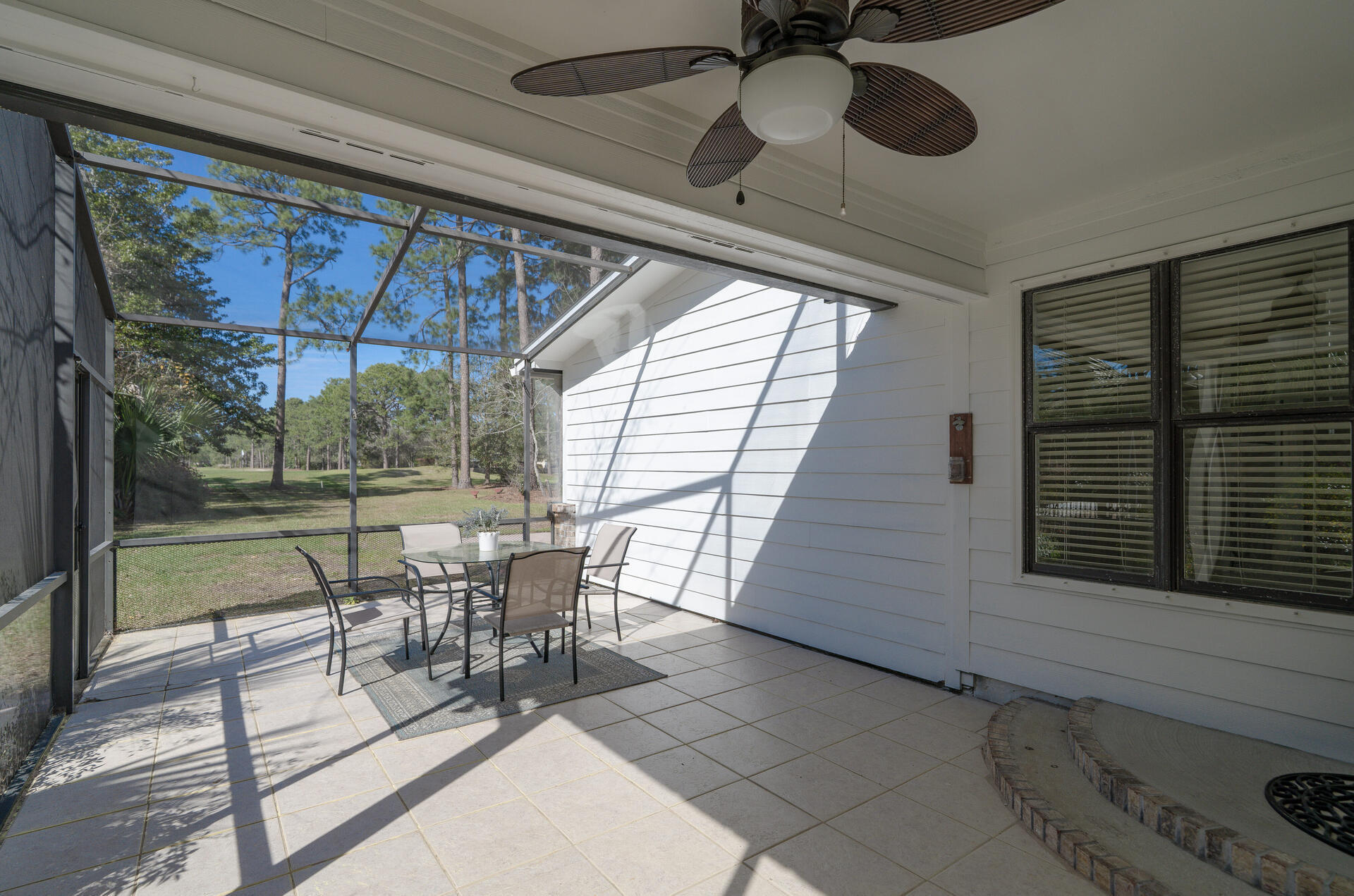 1182 Muirfield Way Niceville, FL 32578 - Photo 40 of 45 a balcony with furniture and a potted plant