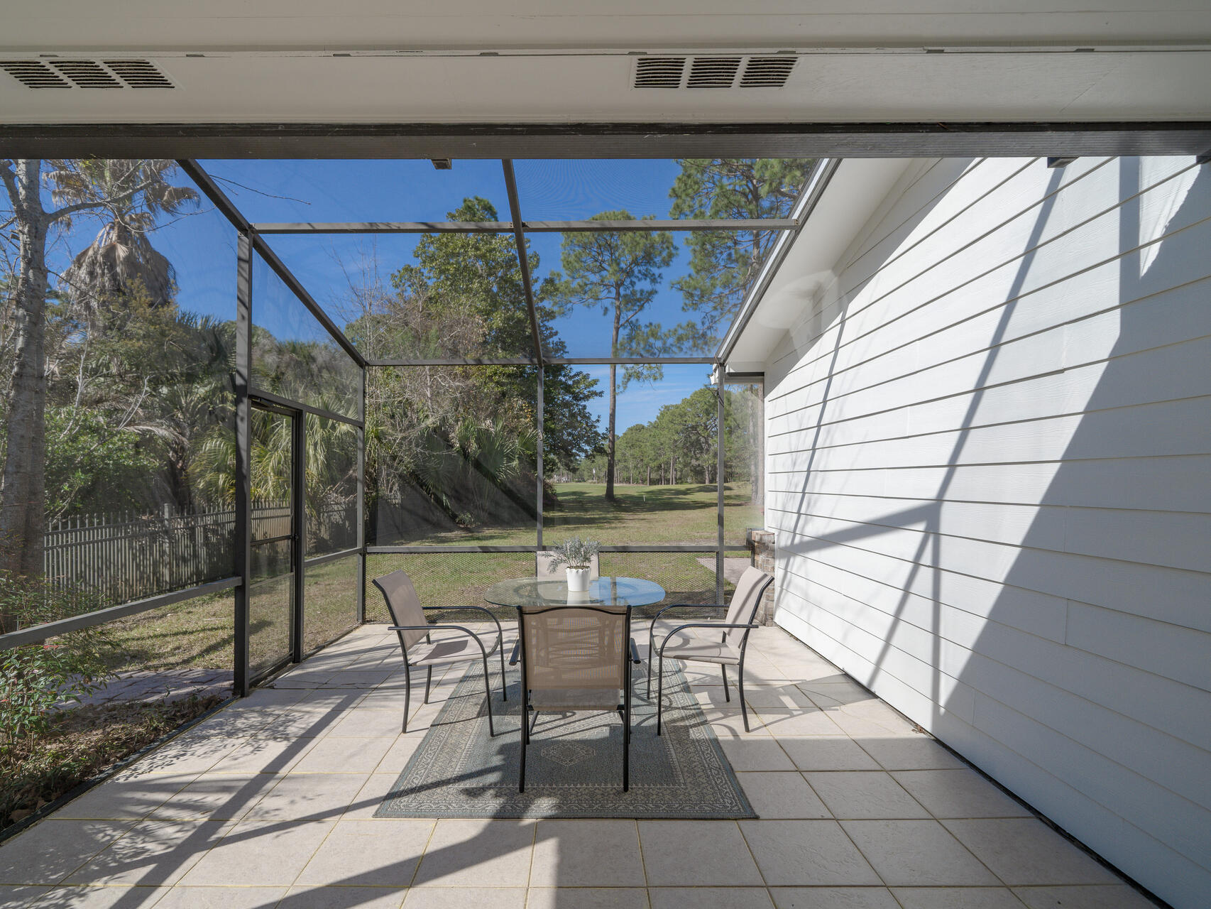 1182 Muirfield Way Niceville, FL 32578 - Photo 41 of 45 a patio with glass top table and chairs