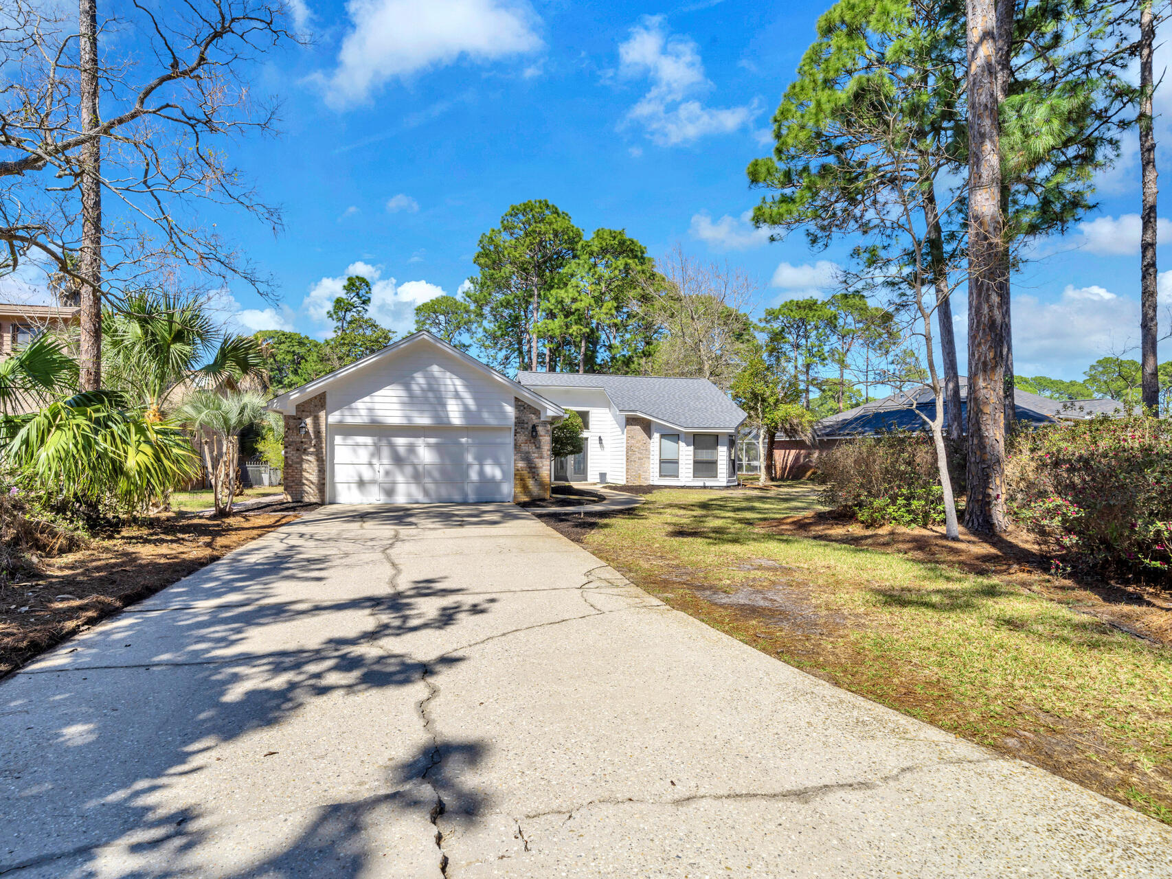 1182 Muirfield Way Niceville, FL 32578 - Photo 43 of 45 a house with a trees in front of it
