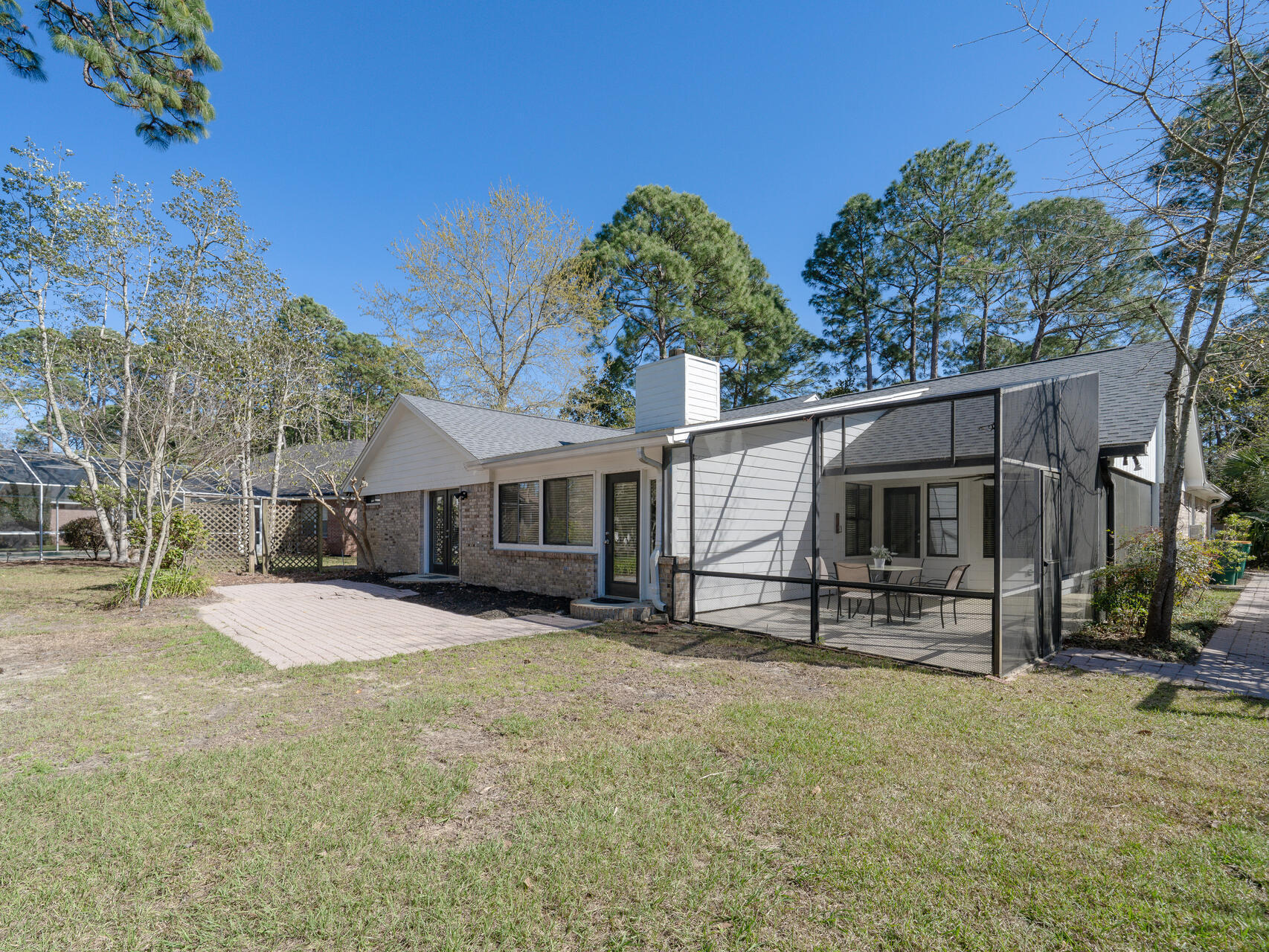1182 Muirfield Way Niceville, FL 32578 - Photo 6 of 45 a house with trees in the background