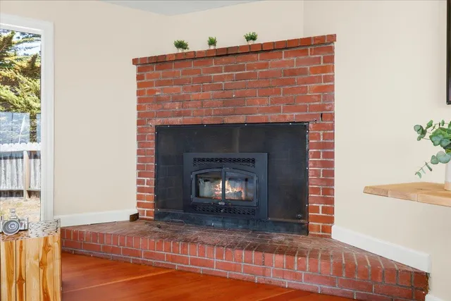 a bedroom with a bed and a dresser with mirror