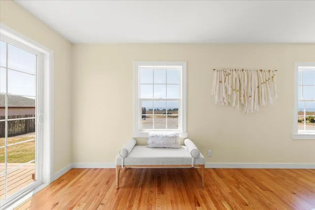 a dining room with furniture and wooden floor