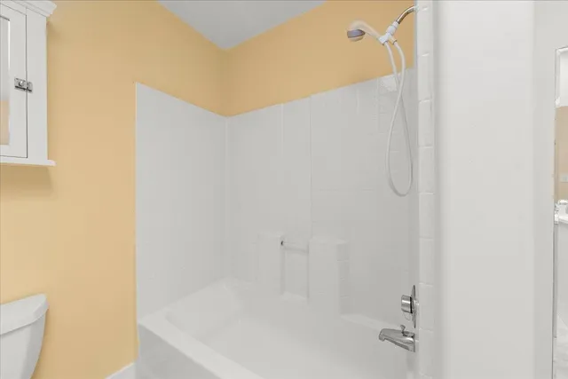 a view of a swimming pool and lounge chair