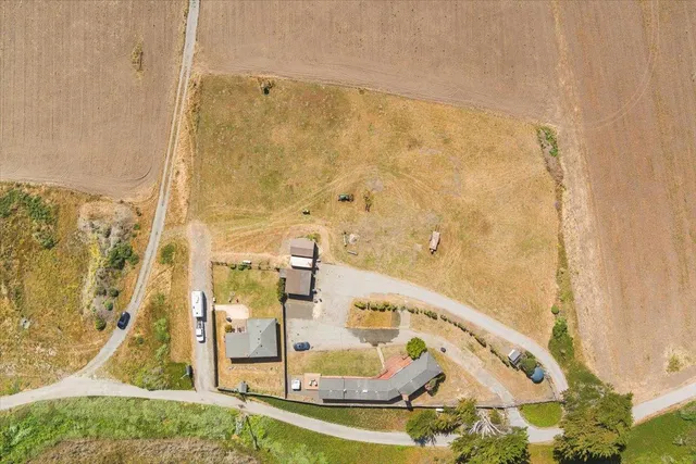 a kitchen with stainless steel appliances granite countertop a refrigerator a stove top oven a sink and dishwasher