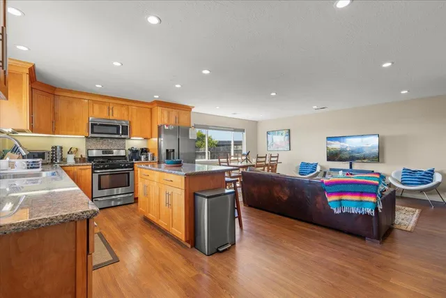 a bathroom with a double vanity sink toilet and shower
