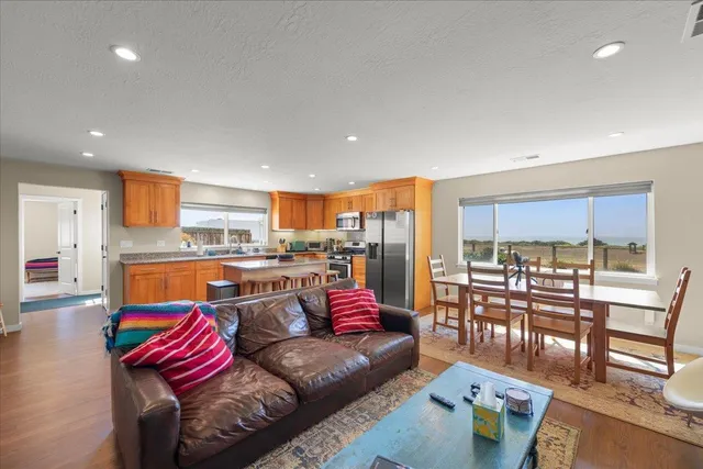 a bedroom with a bed rug and wooden floor